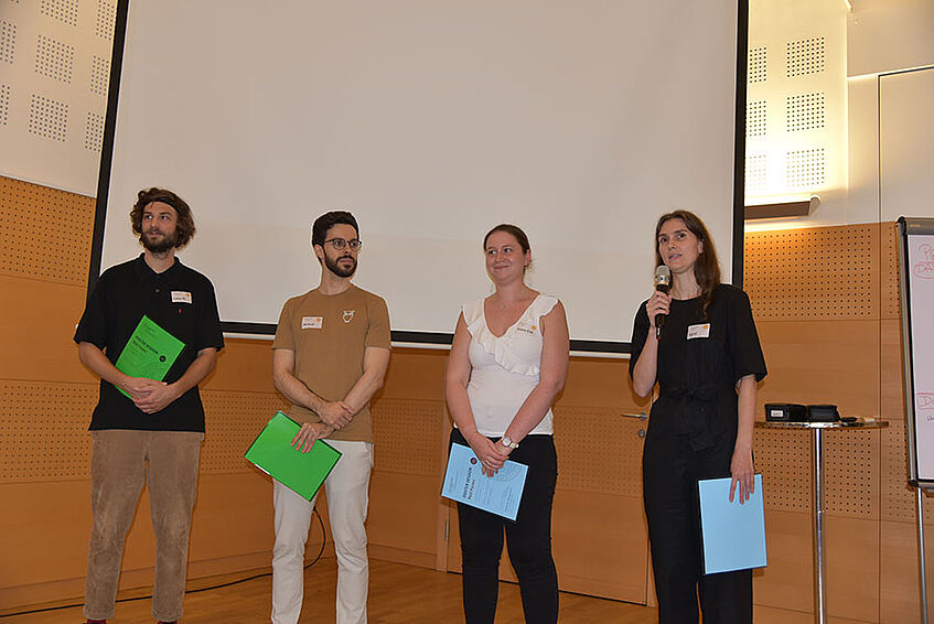 Photo showing from left to right the poster prize winners Lukas Wimmer, Michael Netzer, Verena Schwingenschlögl-Maisetschläger and Sigrid Adelsberger